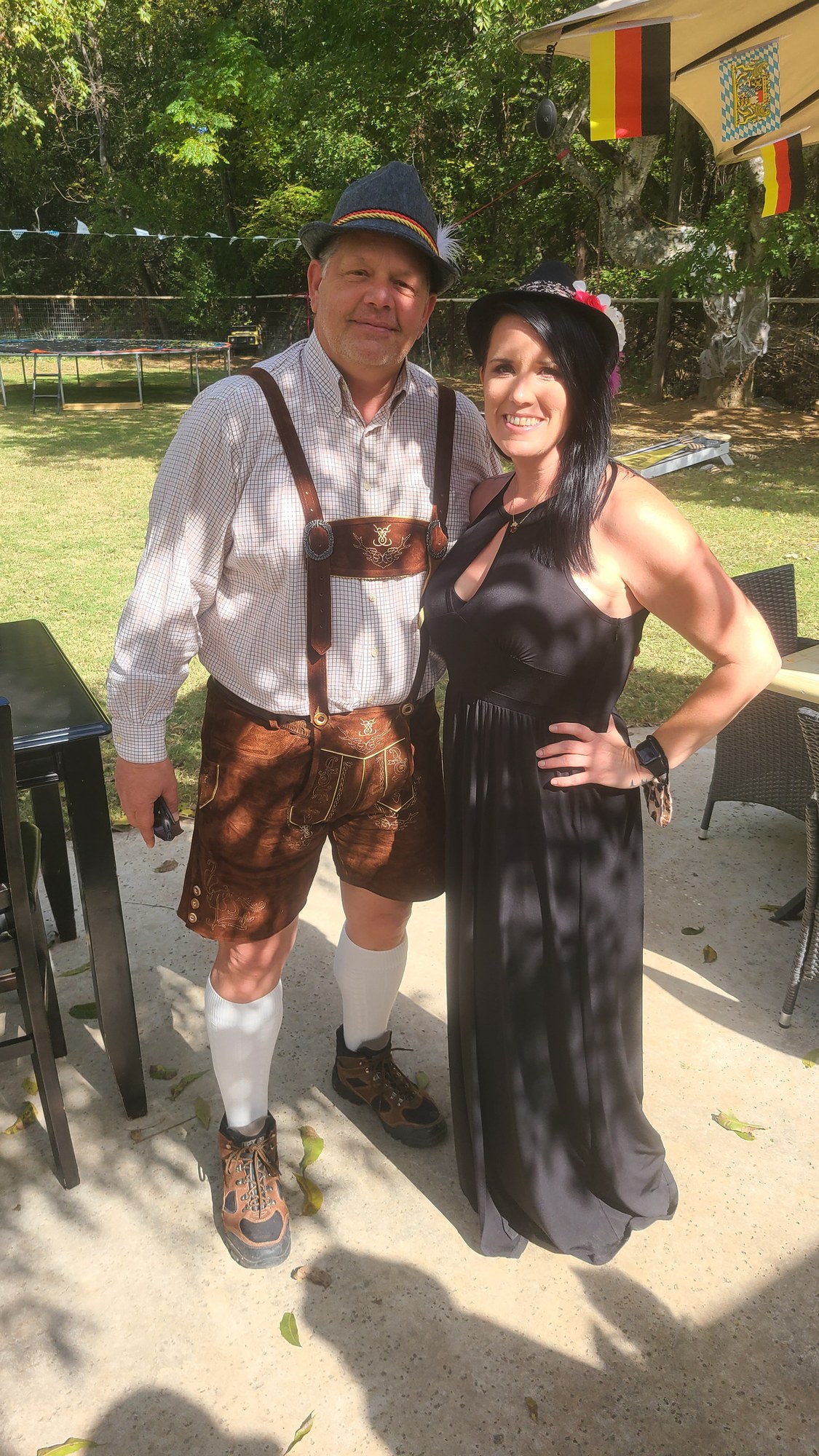 A couple dressed in a dirndl and lederhosen at Bestfest